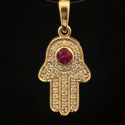 Colgante de oro amarillo con rubí y hamsa de 0,35 ct y 1,4 gr de 14 quilates